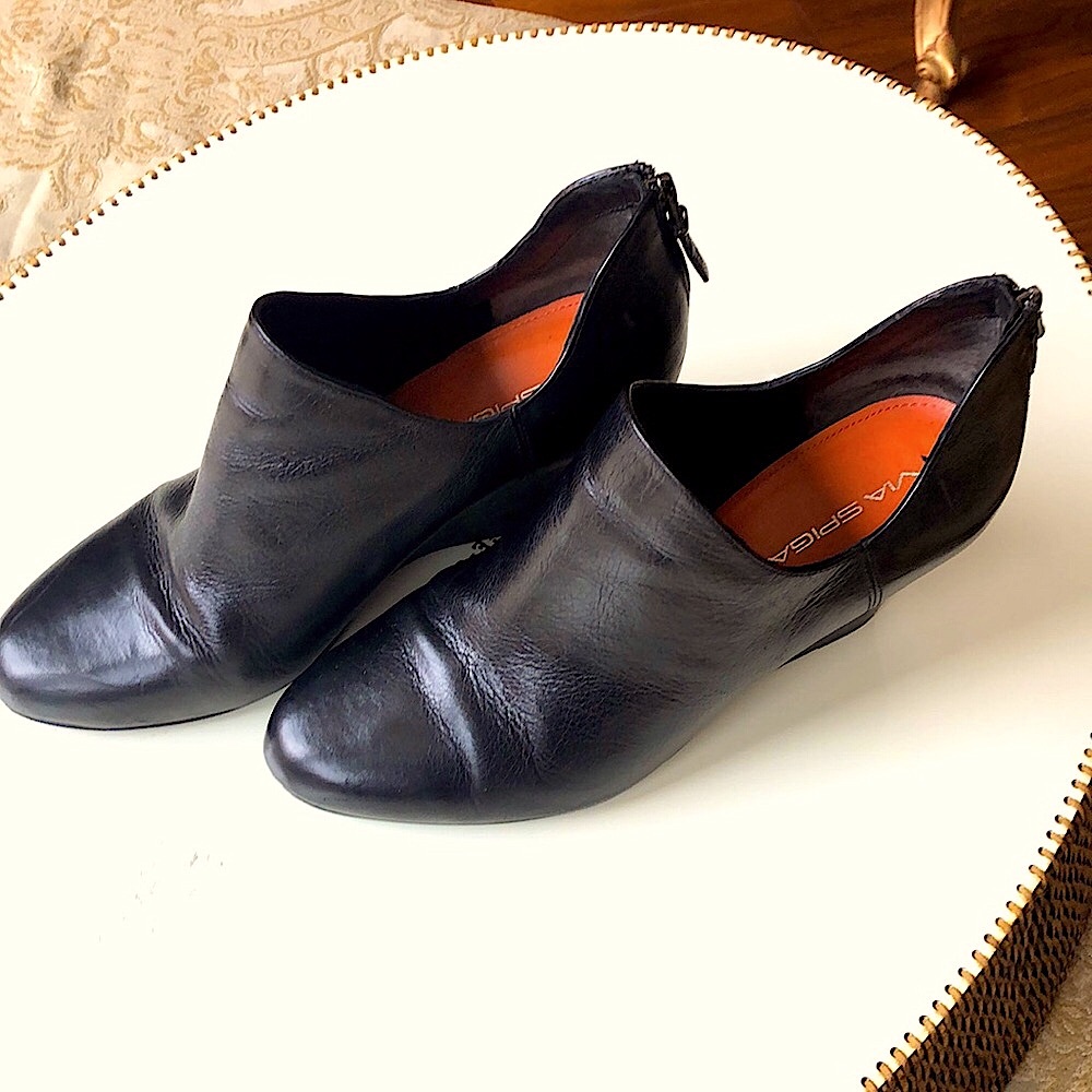 Black Leather 3 inch Booties zip up the back.